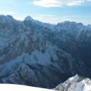 Razgled z vrha na Prisojnik, Triglav, Kanjavec in Veliko Špičje (od leve proti desni)