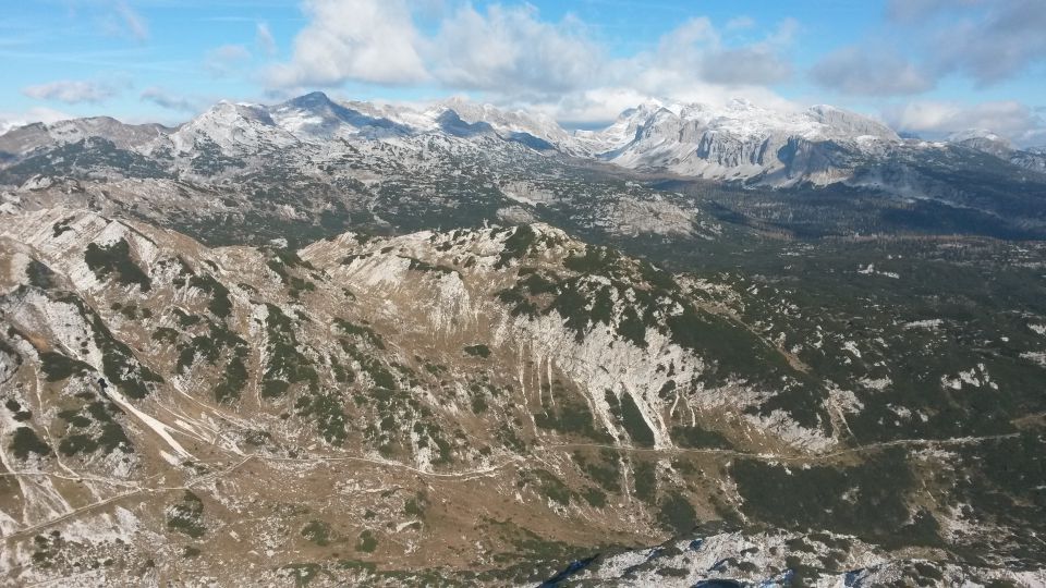 Razgled iz vrha na Plaski Vogel, Špičje, Tičarice, Zelnarice, Vogle in Debeli vrh