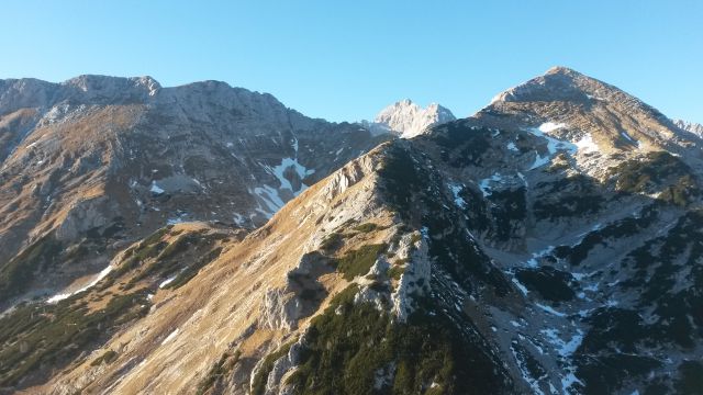 Razgled iz vrha na Tosc, Triglav in Veliki Draški vrh