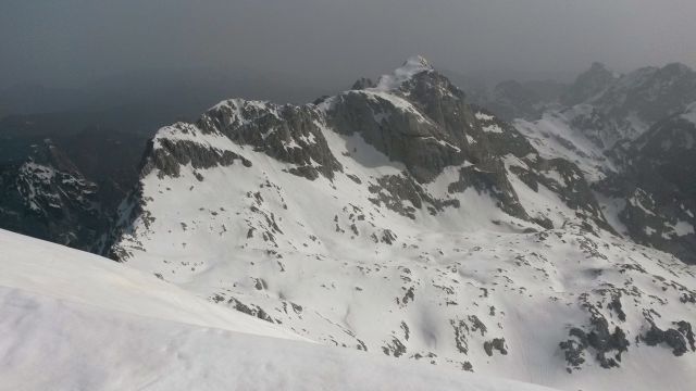 Razgled z vrha Grintovca na Dolgi Hrbet, Štruco in Skuto (od leve proti desni)