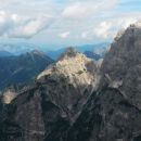 Razgled z vrha Špik Hude police na Svete Višarje, Kamnitega lovca, Veliki Nabojs in Viš