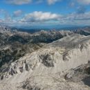 Razgled z vrha Krna na Triglav, Bohinjske hribe in Vrh nad Peski (od leve proti desni)