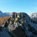 Razgled z vrha Viševnika na Triglav, Mali Draški vrh in Rjavino (od leve proti desni)