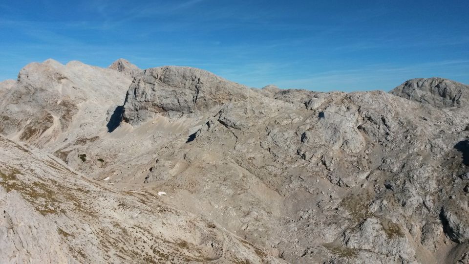 Razgled z vrha Male Zelnarice na Kanjavec, Triglav, Vršake, Vogle in Debeli vrh